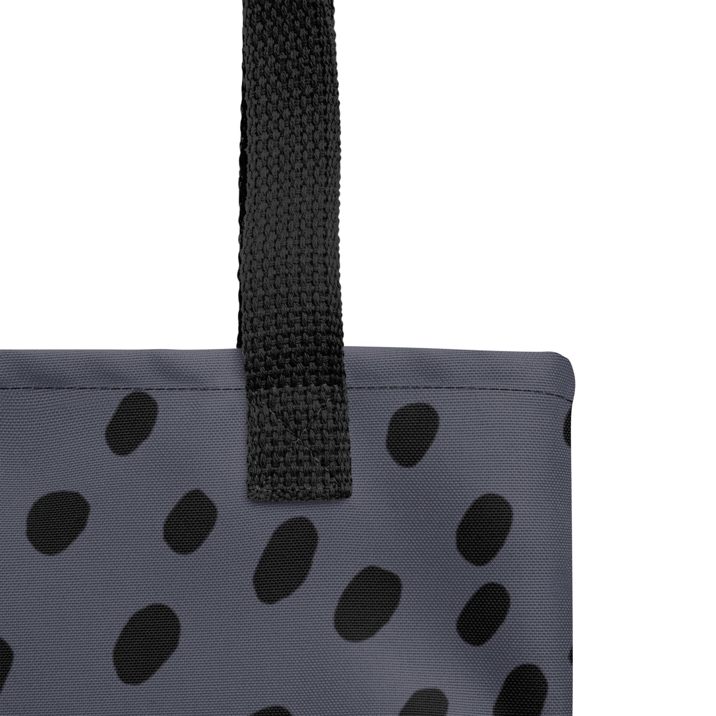 Close-up of the navy blue canvas and minimalist black dot pattern texture by TASHAU.