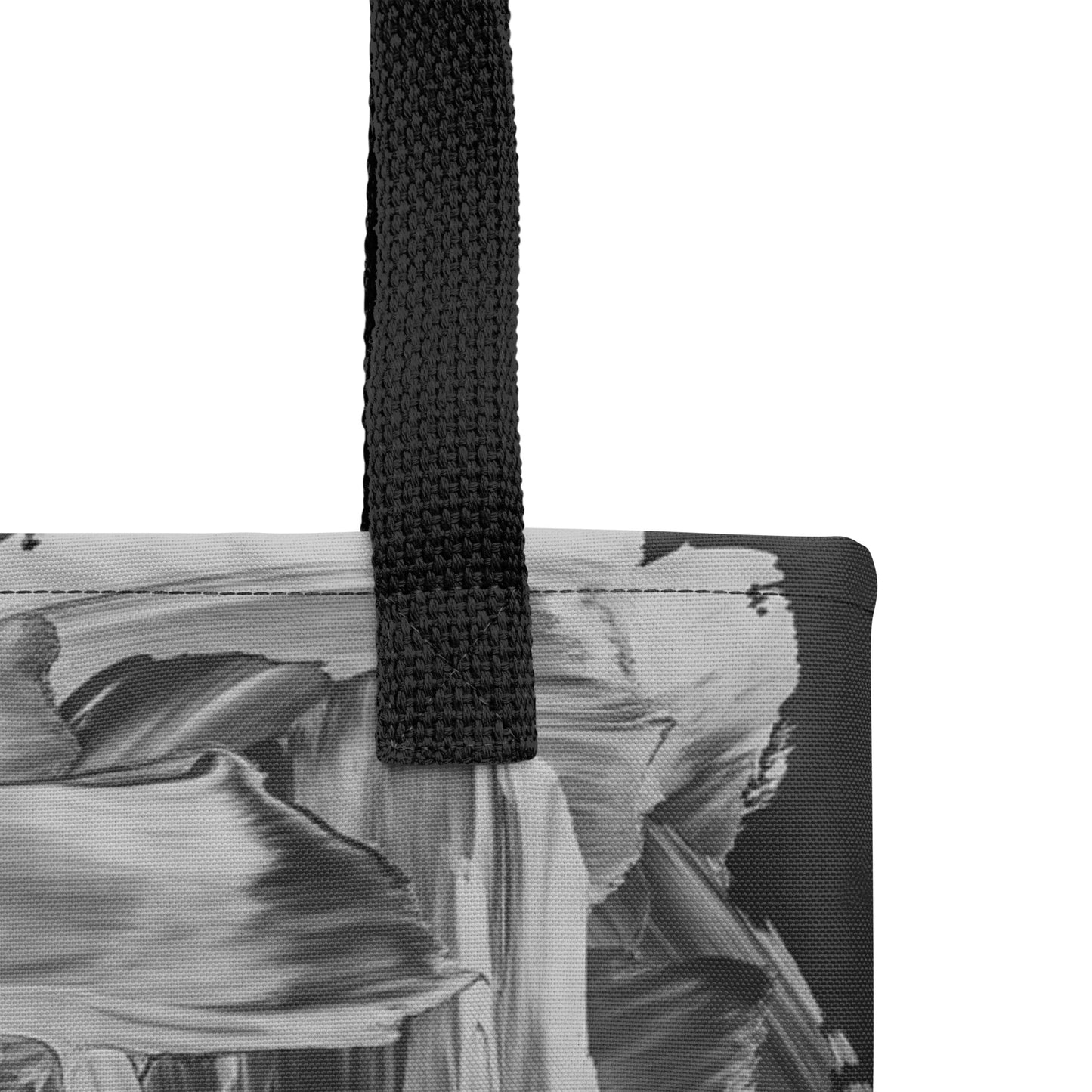 Close-up detail of abstract brushstroke textures on black and silver gray designer canvas tote.