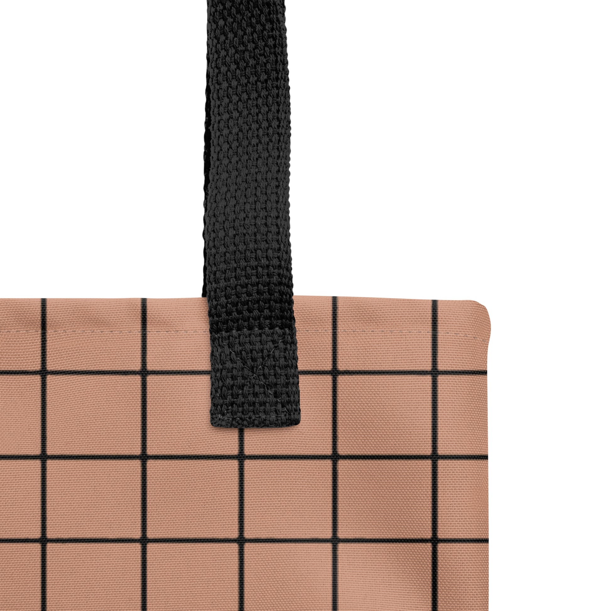 Close-up of a contemporary brown and black gridline handbag by TASHAU.