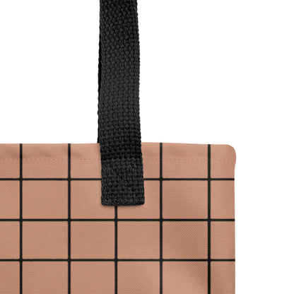 Close-up of a contemporary brown and black gridline handbag by TASHAU.