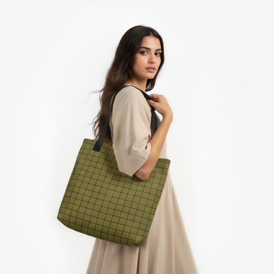 Woman carrying dark green tote bag with black grid pattern by TASHAU.