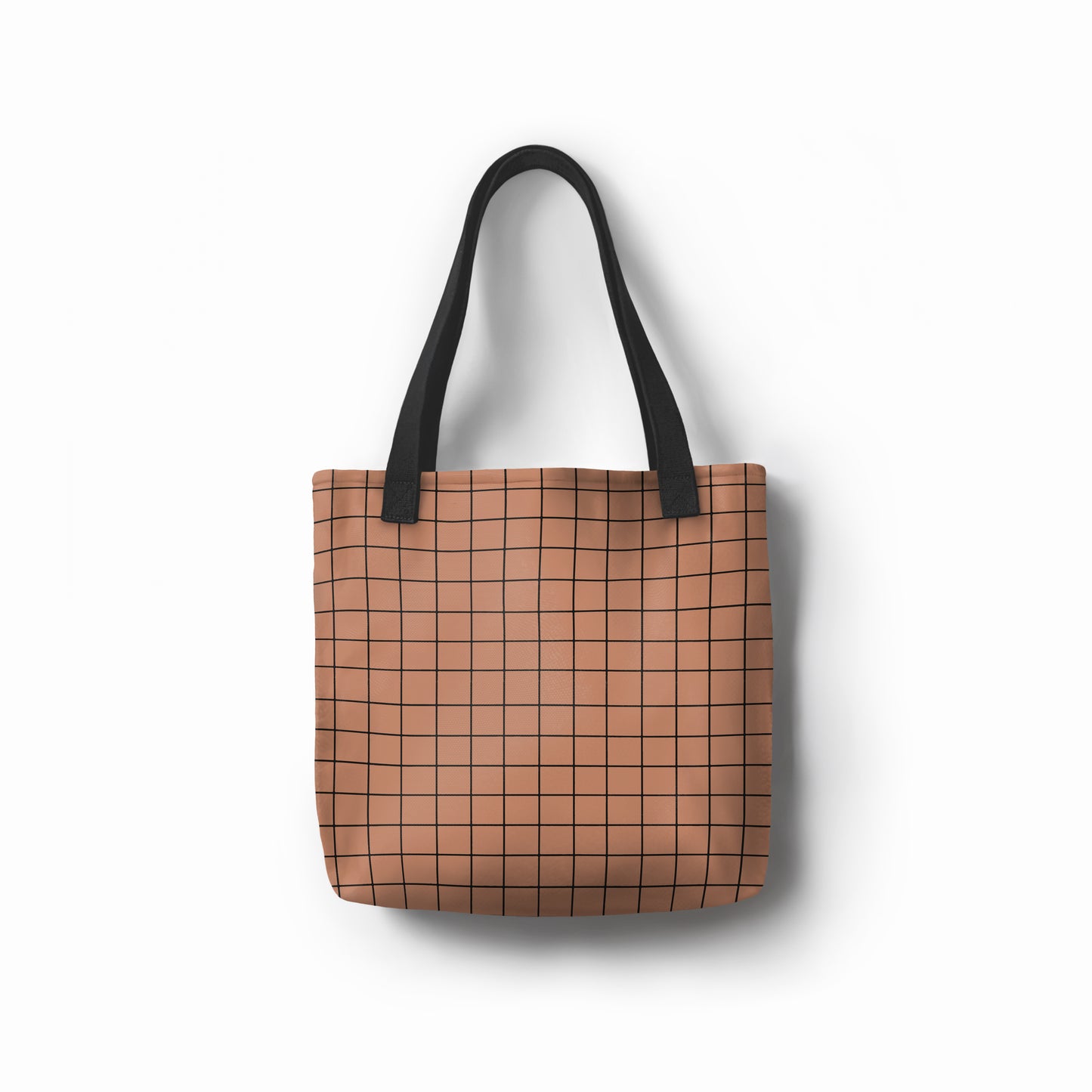Modern canvas carryall in warm brown with geometric grid design.