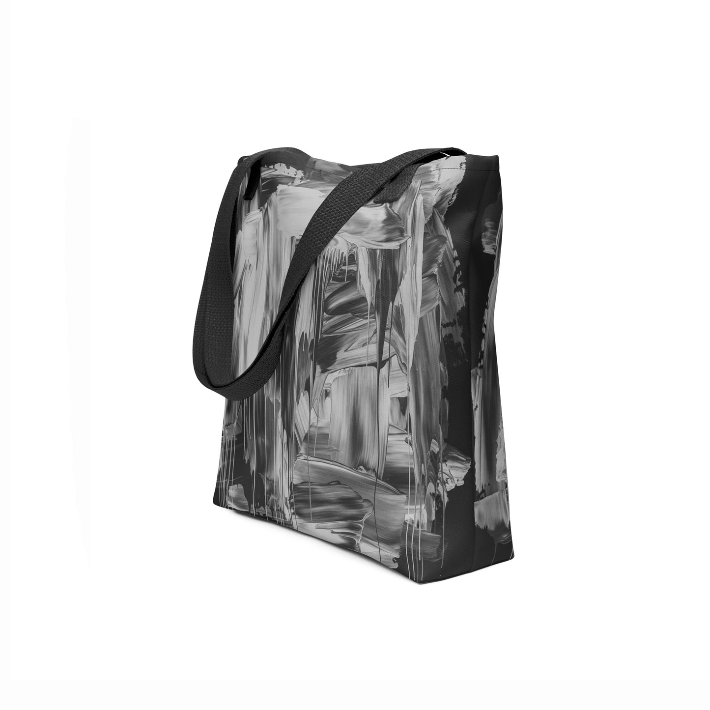 Side angle of Monochrome Flux tote bag showing durable black straps and modern artistic print.