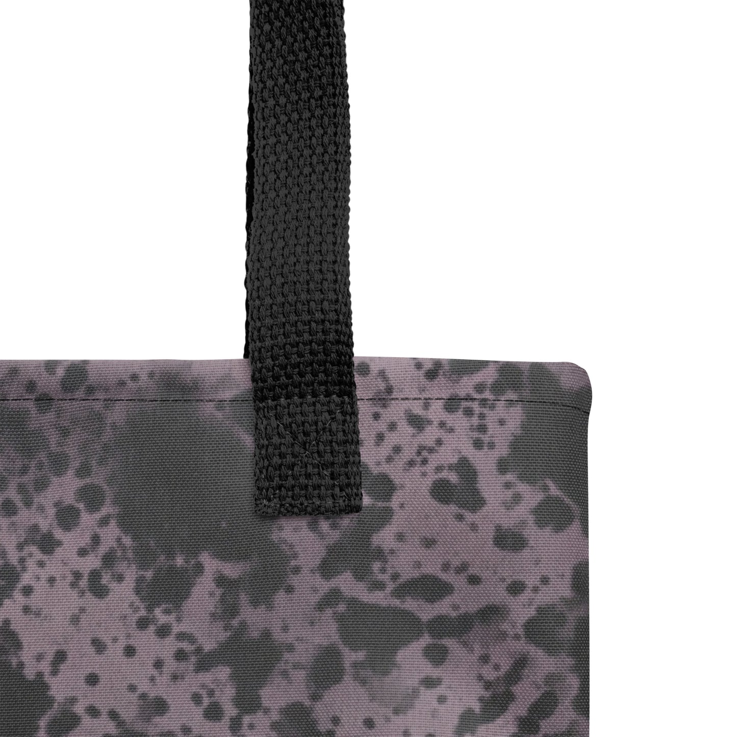 Close-up of a fashion tote bag with charcoal black and dusty purple artistic abstract print.