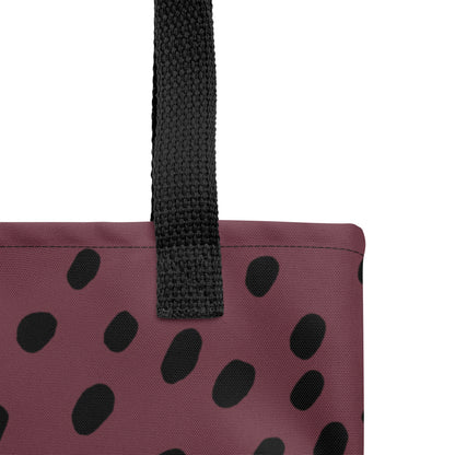Close-up of TASHAU tote showing fabric texture and bold black dot accents on a white background.