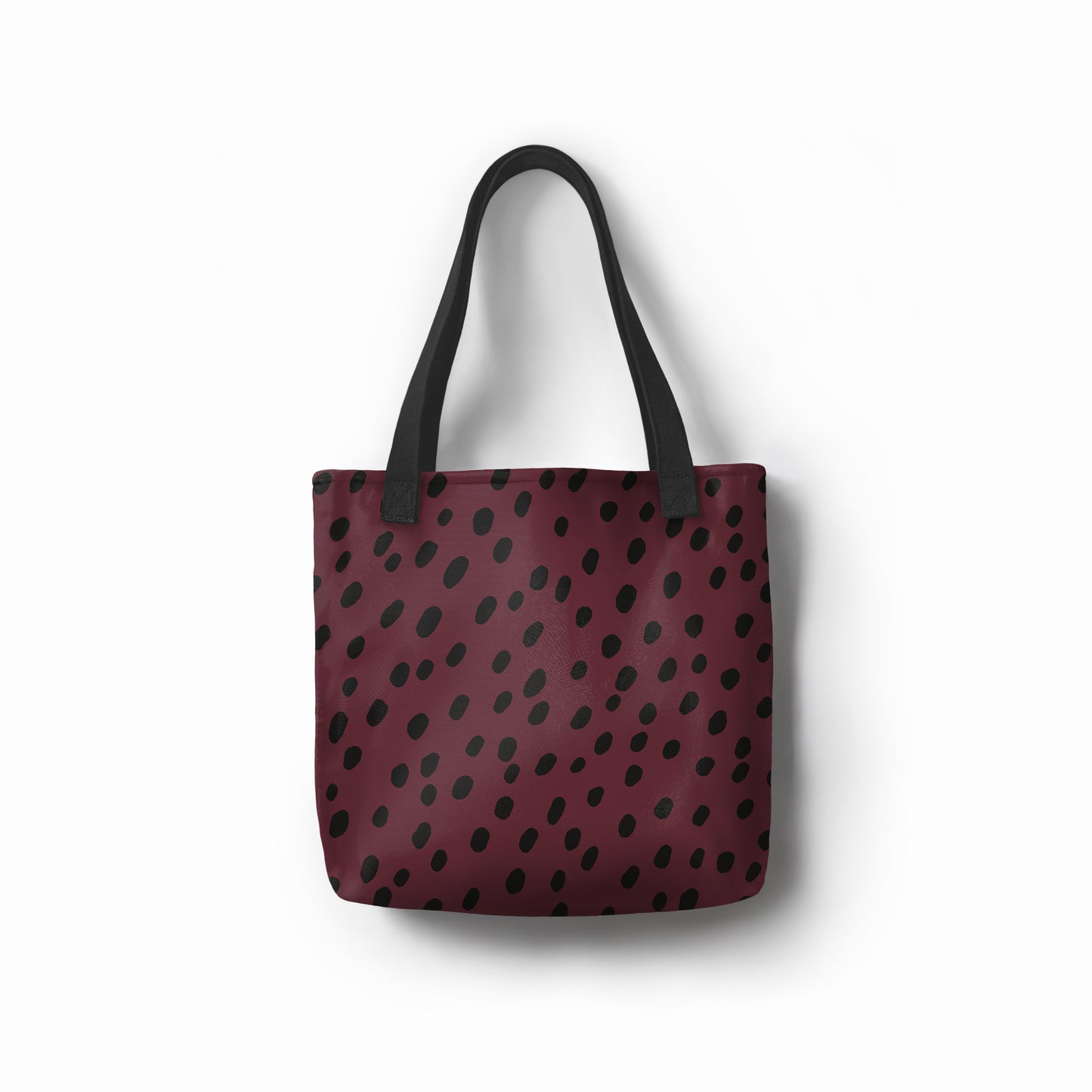 TASHAU eco-friendly burgundy tote bag with black dots, durable for everyday use.