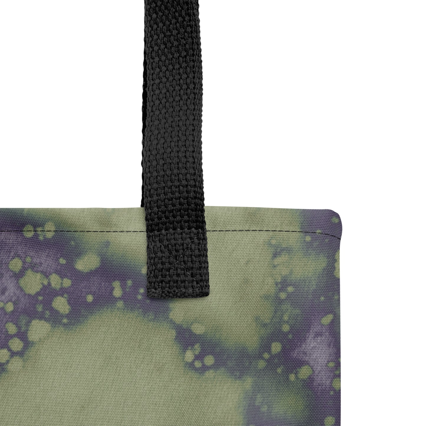 Close-up of unique handmade artistic tote bag with deep indigo and green abstract flow.