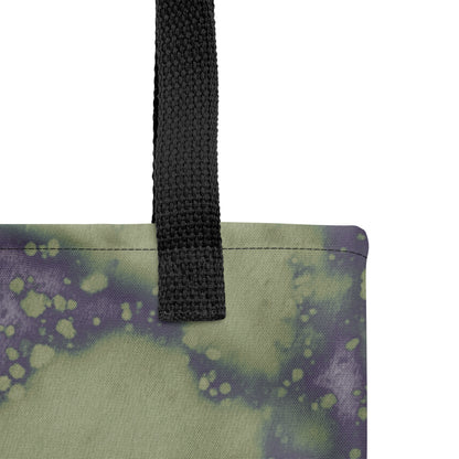 Close-up of unique handmade artistic tote bag with deep indigo and green abstract flow.