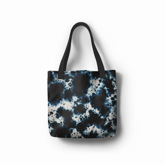 TASHAU Midnight Tide tote bag with deep blue ocean-inspired pattern.