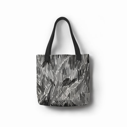 Eco-friendly grey tote bag with abstract charcoal brushstroke design by TASHAU.
