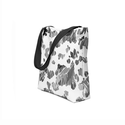 Side angle of a white tote bag with black abstract pattern on a white background by TASHAU.