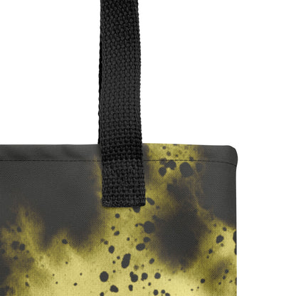 Close-up of a designer canvas tote for everyday use in black with glowing golden-yellow accents.