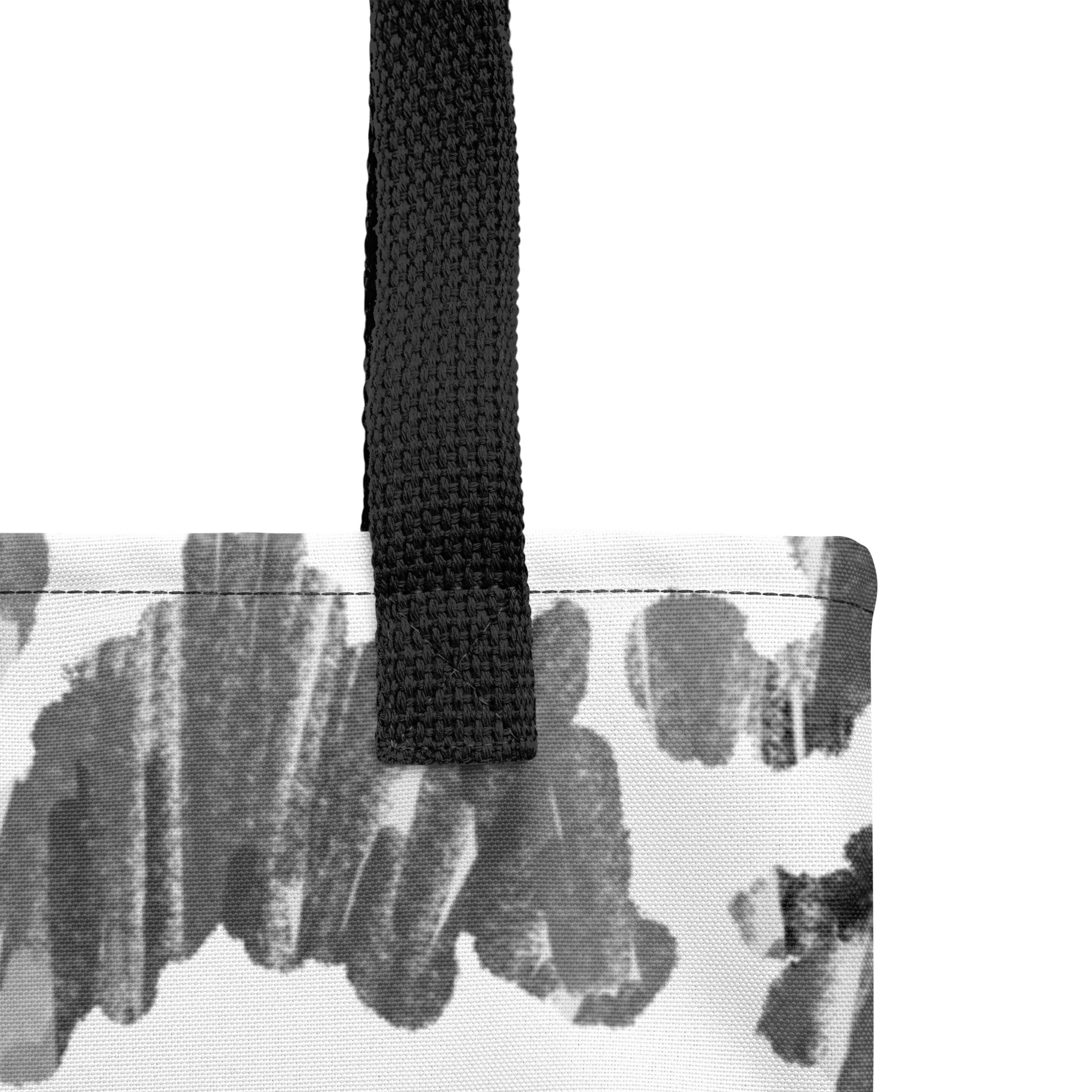 Close-up of a durable cotton tote bag with patterned black and white artistic design by TASHAU.