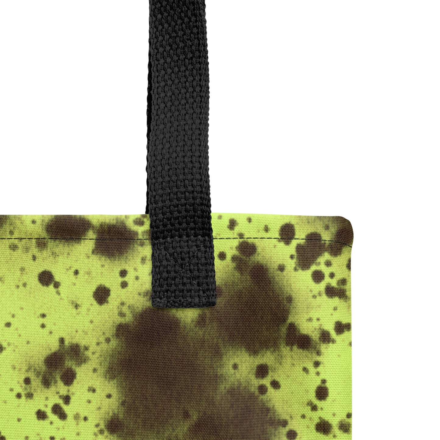 Close-up detail of durable canvas tote bag in neon green with black splatter abstract print by TASHAU.