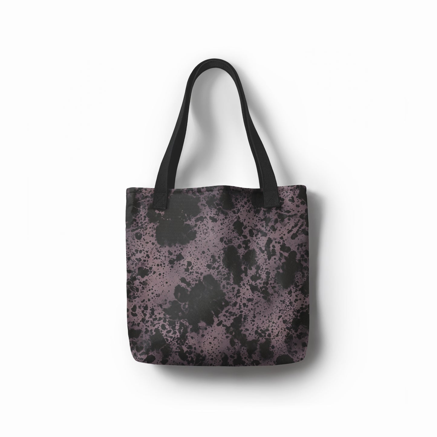 Front view of artistic tote bag in charcoal black and dusty purple abstract stone texture. Designed by TASHAU.