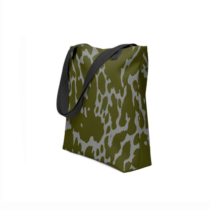 Side angle of TASHAU eco-friendly canvas tote in earthy olive green with smoky gray patterns