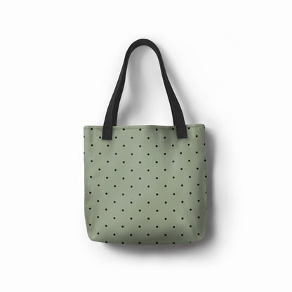 Unisex shopper bag in sage green with modern black dot pattern.