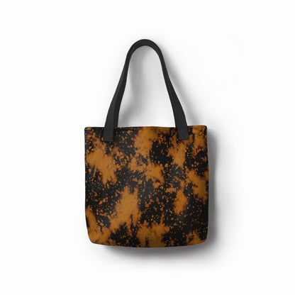 Black and gold tote bag featuring Golden Nightfall artistic splatter pattern – chic fashion accessory designed by TASHAU.