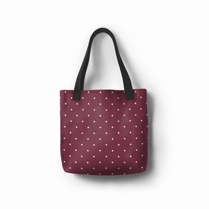 Burgundy dots tote bag with wine red base and white polka dot pattern.