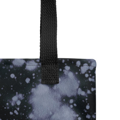 Sustainable canvas tote bag with black and indigo blue cosmic-inspired design.
