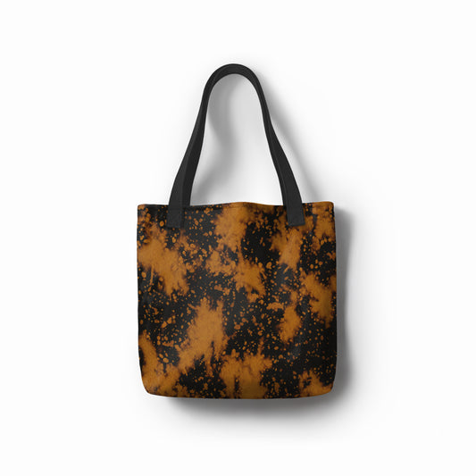 Golden Nightfall tote bag in luxe black with gold artistic splatter design – bold statement shopper bag. Designed by TASHAU.