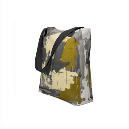 Handcrafted tote bag with textured gray base and golden highlights by TASHAU.