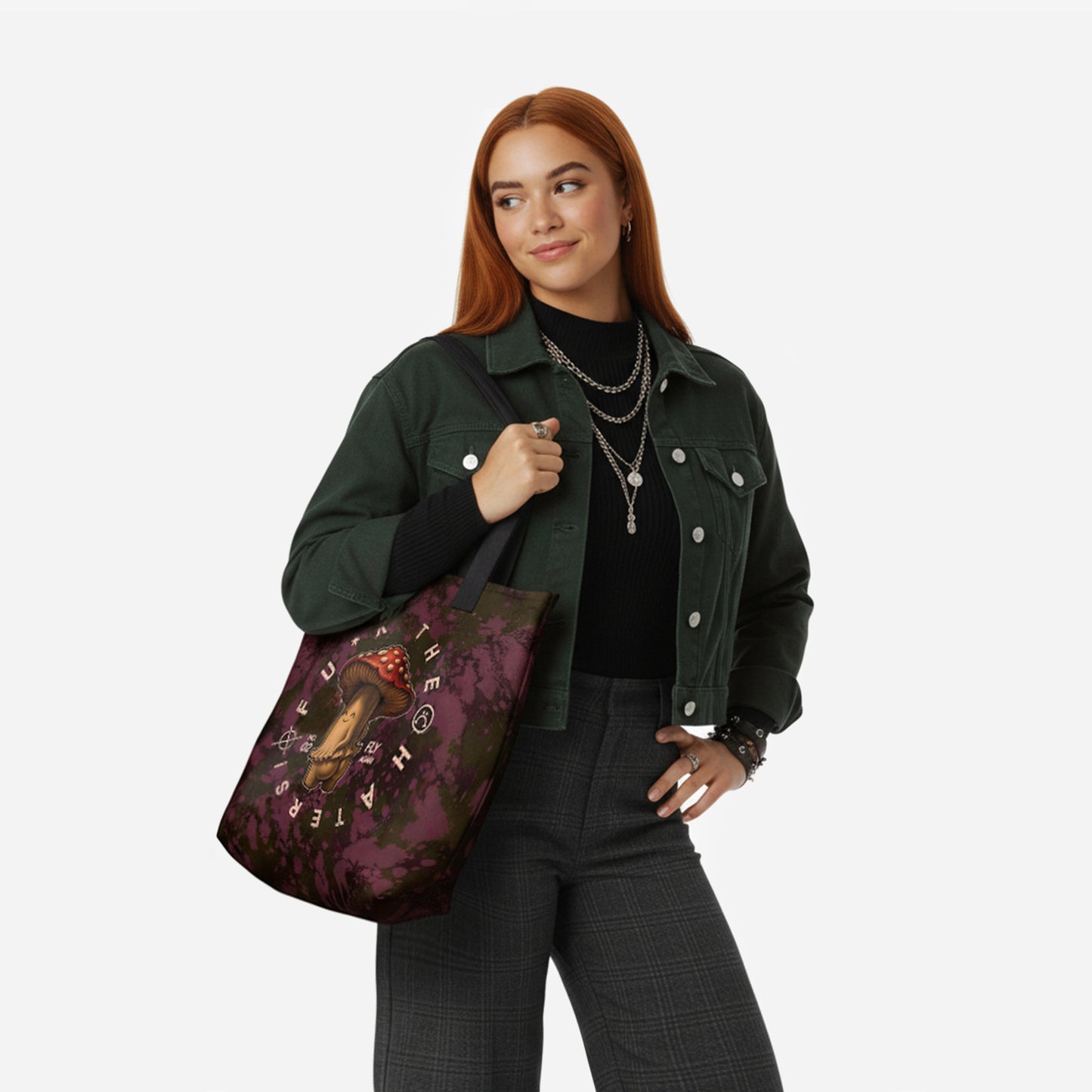 Woman holding a burgundy tote bag with a mushroom rebel sarcastic design.