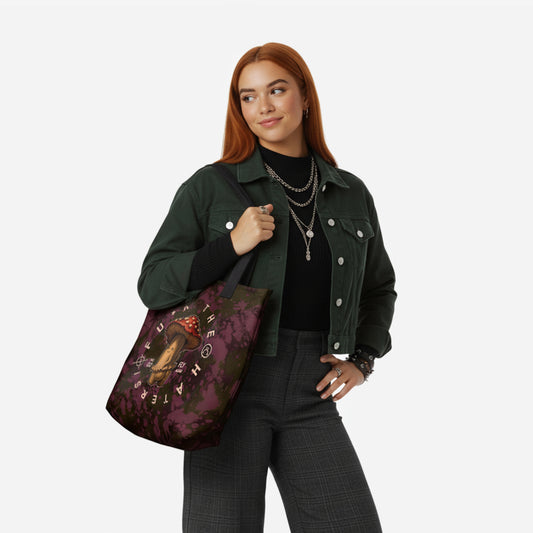 Woman holding a burgundy tote bag with a mushroom rebel sarcastic design.