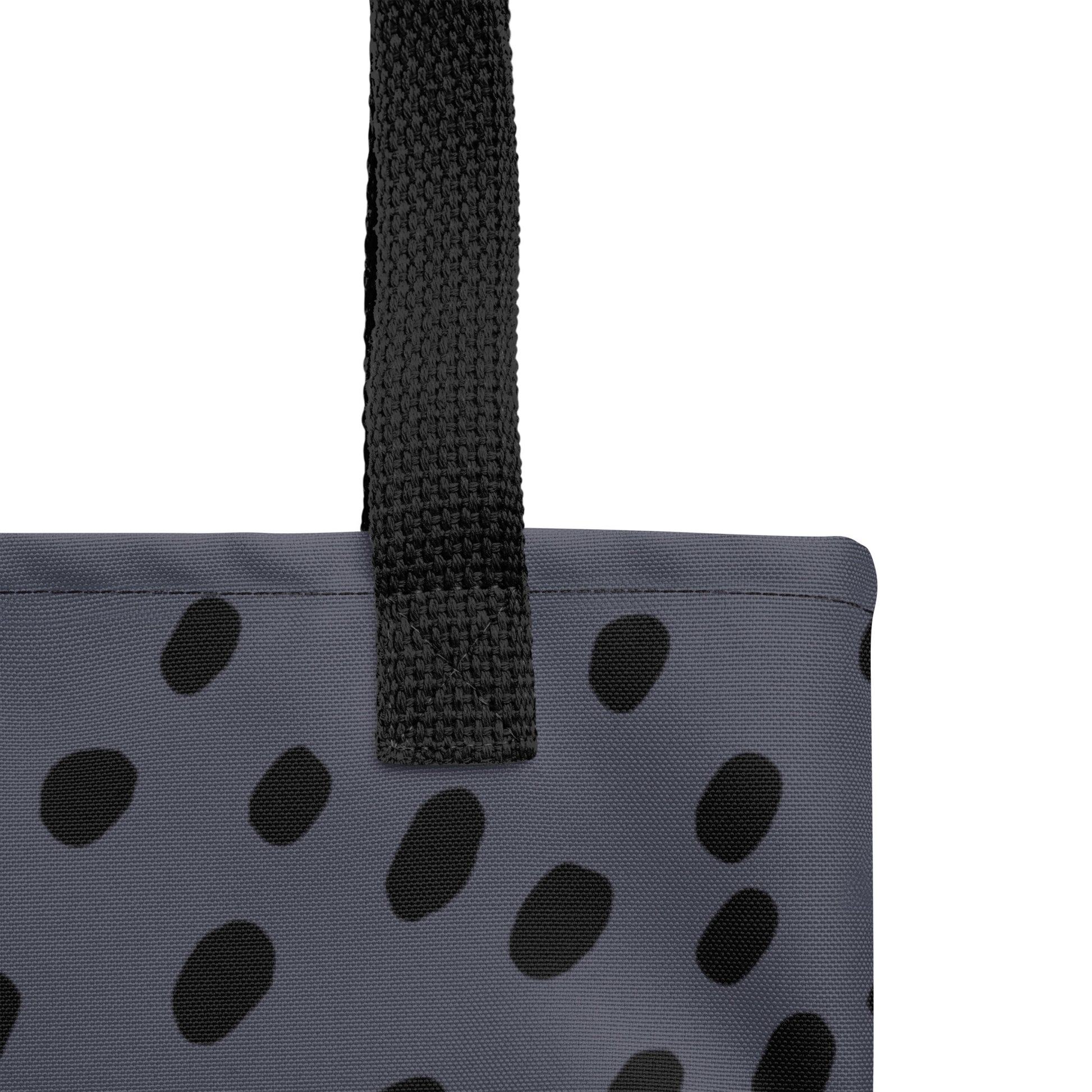 Close-up of the navy blue canvas and minimalist black dot pattern texture by TASHAU.