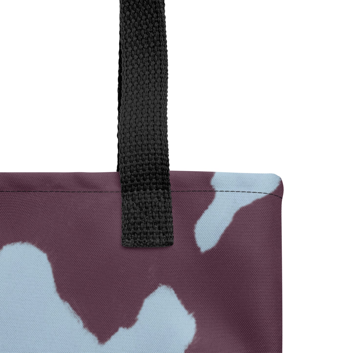 Close-up of an ocean-inspired tote bag blending maroon and sky blue artistic tones. Shop at TASHAU.