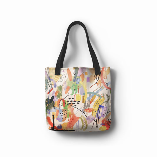 Blooming Silence tote bag with vibrant brushstrokes in red, yellow, green, and blue on a creamy base – TASHAU unisex shopper.